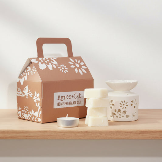 Agnes & Cat home fragrance set with cardboard box, candles, and diffuser on a white background